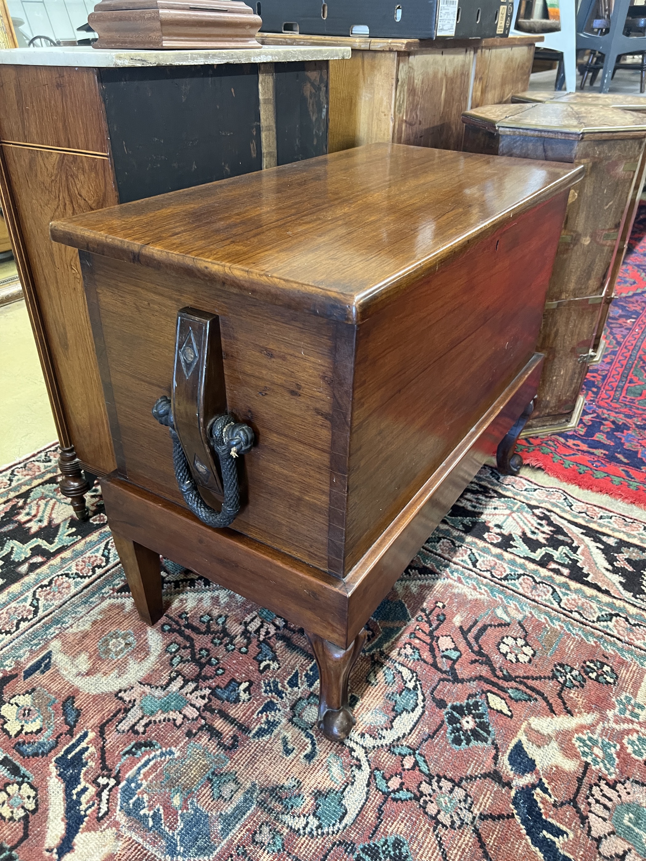 A 19th century hardwood seaman's chest on associated stand, width 89cm, depth 45cm, height 72cm together with an inlaid cigarette box